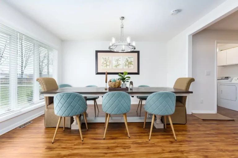 The dining room overlooks the lush front yard and can flexibly seat 10-12. The dining room opens directly to the family room as well as the kitchen with breakfast bar seating .