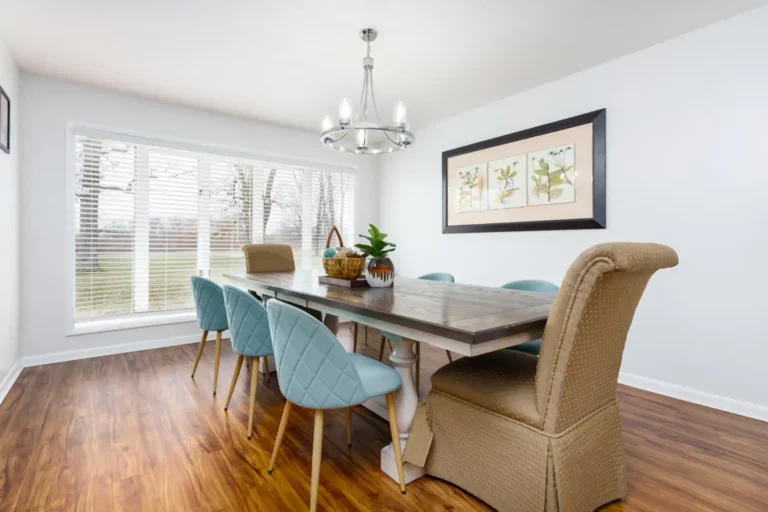 The dining room overlooks the lush front yard and can flexibly seat 10-12. The dining room opens directly to the family room as well as the kitchen with breakfast bar seating.
