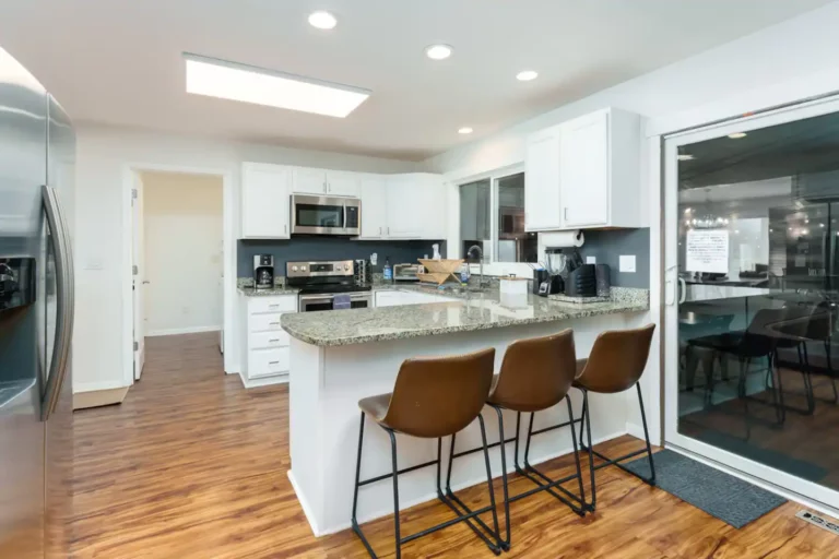 The kitchen includes seating for 3, connects to the pool room, dining room, living room and laundry room.