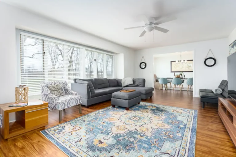 The large family room connects to the dining room and boasts several seating areas. A futon can serve dual duty as a sofa or a single bed. There is a 65 smart tv with cable and streaming service.