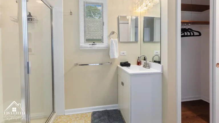 The primary bath is conveniently laid out with easy access to a dressing area with two closets.