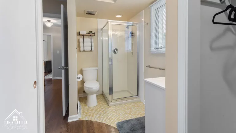 The primary bath is ensuite and includes a shower, vanity and eco-toilet. The bathroom opens to a dressing area, which includes 2 closets.
